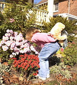 Child Smelling Plants